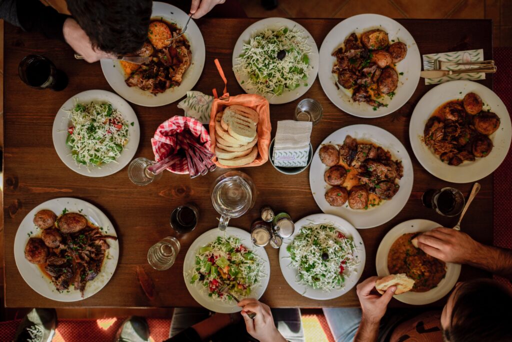 Table with various food options on plates