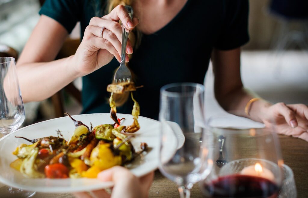 Woman eating in a vegetarian restaurant