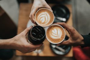 People toasting with coffee